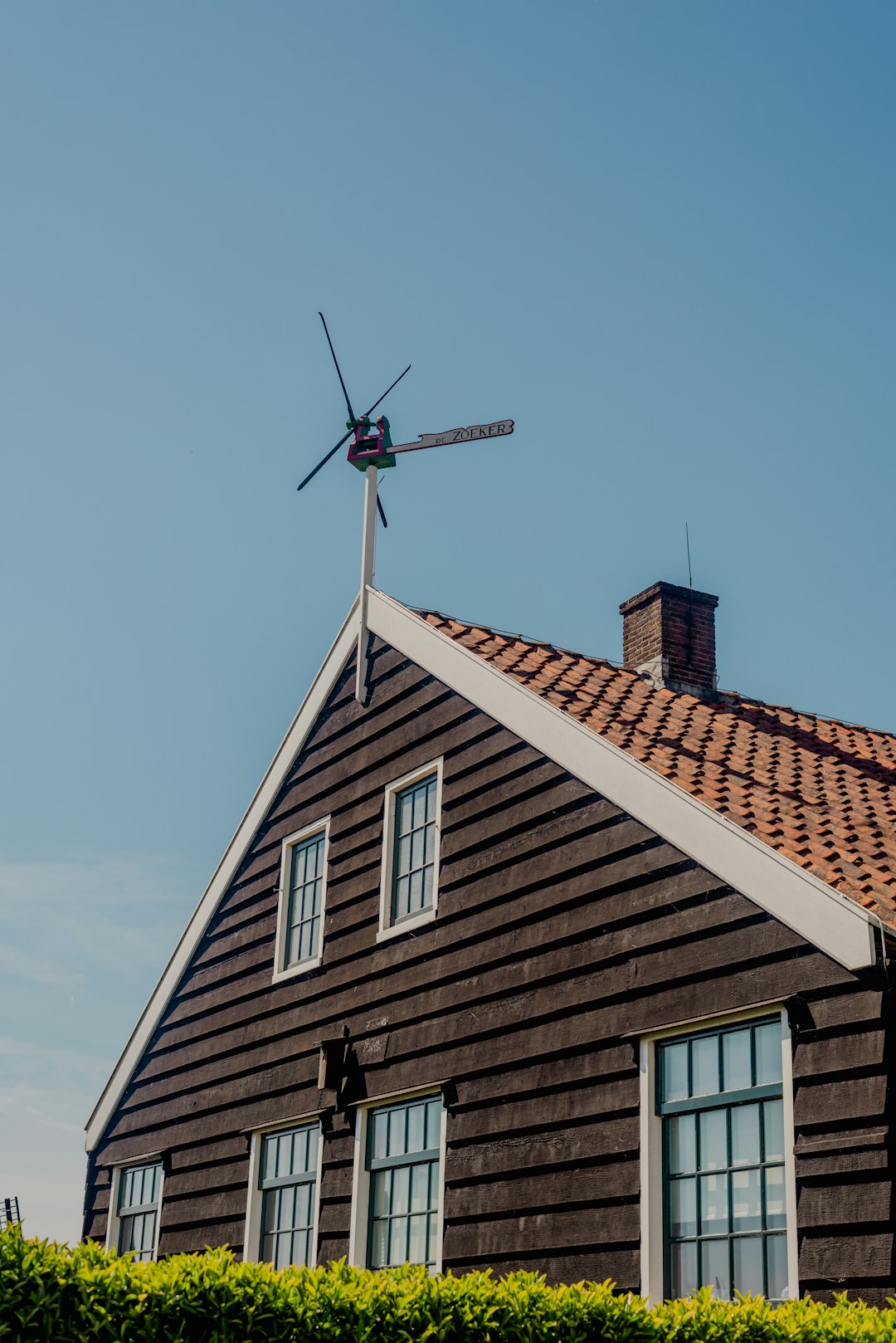 a-house-with-a-windmill-on-top-of-it-kseuc-ubsuo